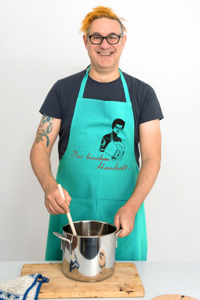 Bio-Schürze handgewebt "Das bisschen Haushalt..." türkis